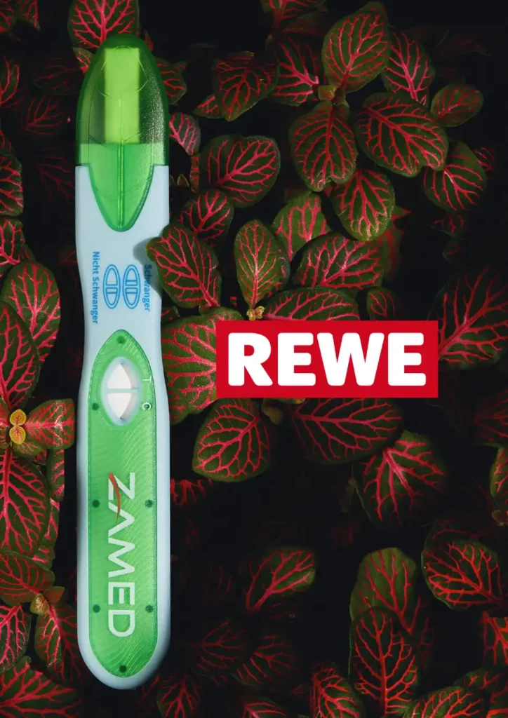 The image features a pregnancy test branded 'TerraTrust' by Zamed, prominently displayed against a vibrant backdrop of leaves with striking red veins, which sets a vivid contrast to the green of the test. The REWE logo is visible, highlighting the partnership between TerraTrust and REWE in offering eco-friendly healthcare options in Germany. This partnership signifies a major stride towards integrating sustainability into daily living, making eco-conscious choices more accessible through REWE Centers. TerraTrust exemplifies sustainable innovation, marrying quality and environmental responsibility. The availability of this eco-friendly pregnancy test at REWE is a call to action for consumers to participate in sustainable living, emphasizing each purchase as a step towards mitigating single-use plastic pollution and supporting a healthier planet. The article encourages readers to join the green mission, reinforcing the message that sustainable choices are not only possible but also desirable for a healthier future.